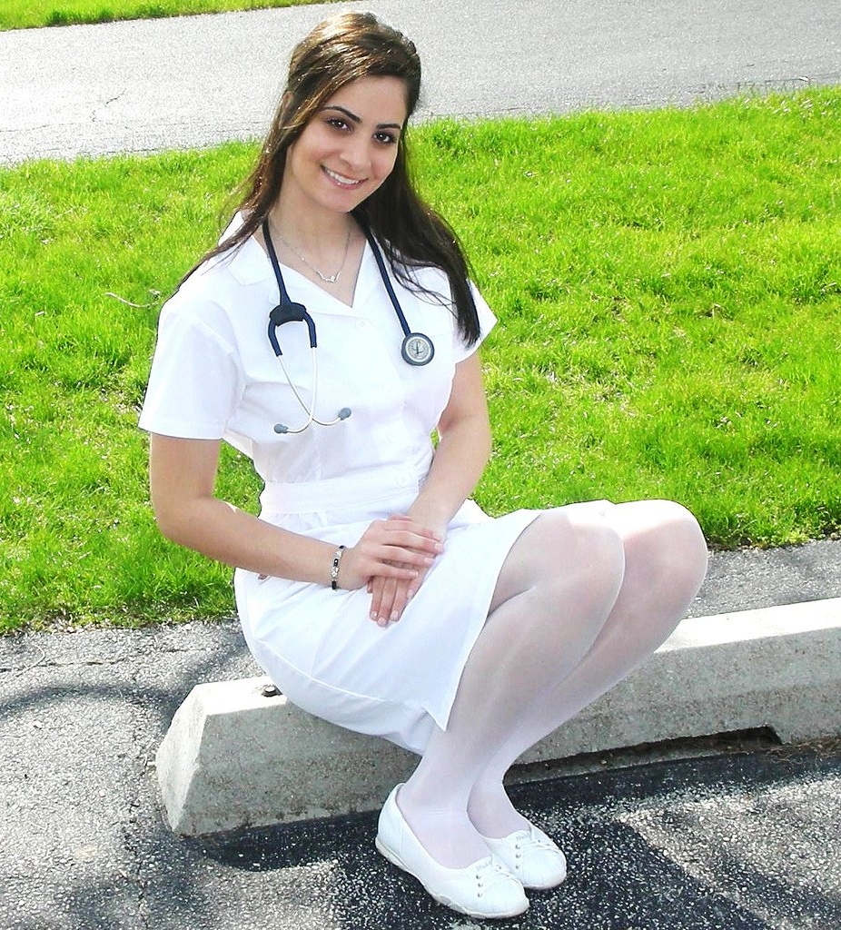 Brunette Nurse wearing White Opaque Shiny Pantyhose and White Short Dress